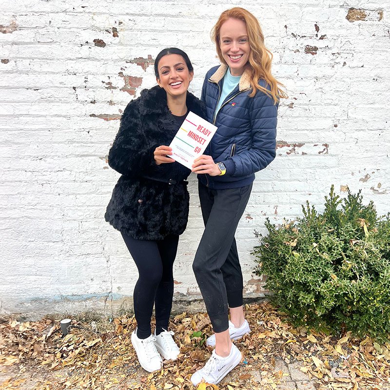 Author Macy Troyer holding her book Ready, Mindset, Go