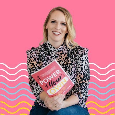 Author Nikki Groom holding a copy of her book, A Power of Your Own