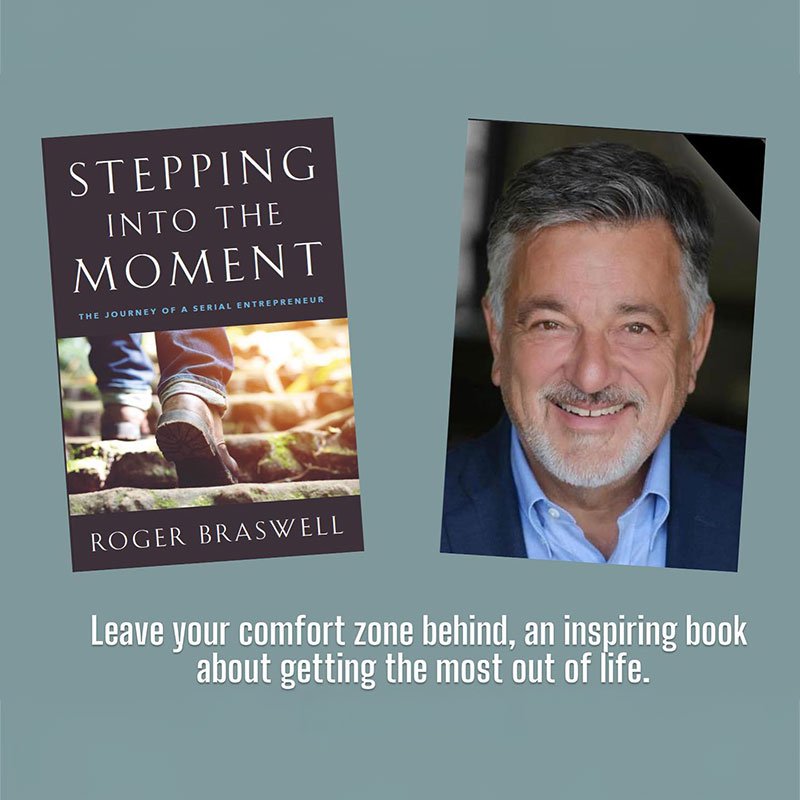 Author Roger Braswell with a cover of his book Stepping into the Moment