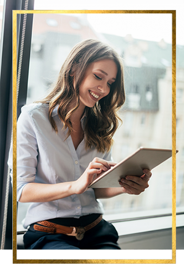 A woman reading an e-book on a tablet
